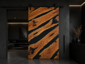Tiger-stripe wooden sliding door in a dark, modern showroom, showcasing handcrafted doors and wooden furniture.