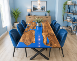 Custom live-edge wooden dining table with a blue resin inlay, handcrafted by a woodworking company that makes wooden tables and doors.