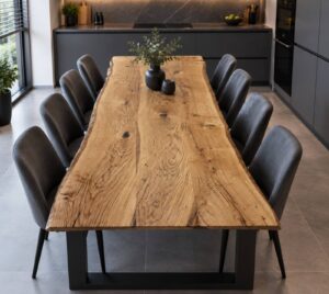 Handcrafted solid wood dining table with black metal legs in a modern kitchen setting, from a company specializing in wooden tables and doors.