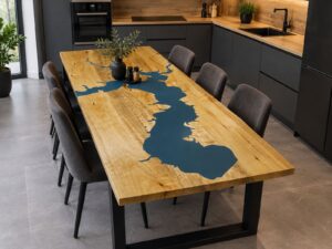 Handcrafted wooden dining table with a blue map-shaped inlay in a contemporary kitchen.